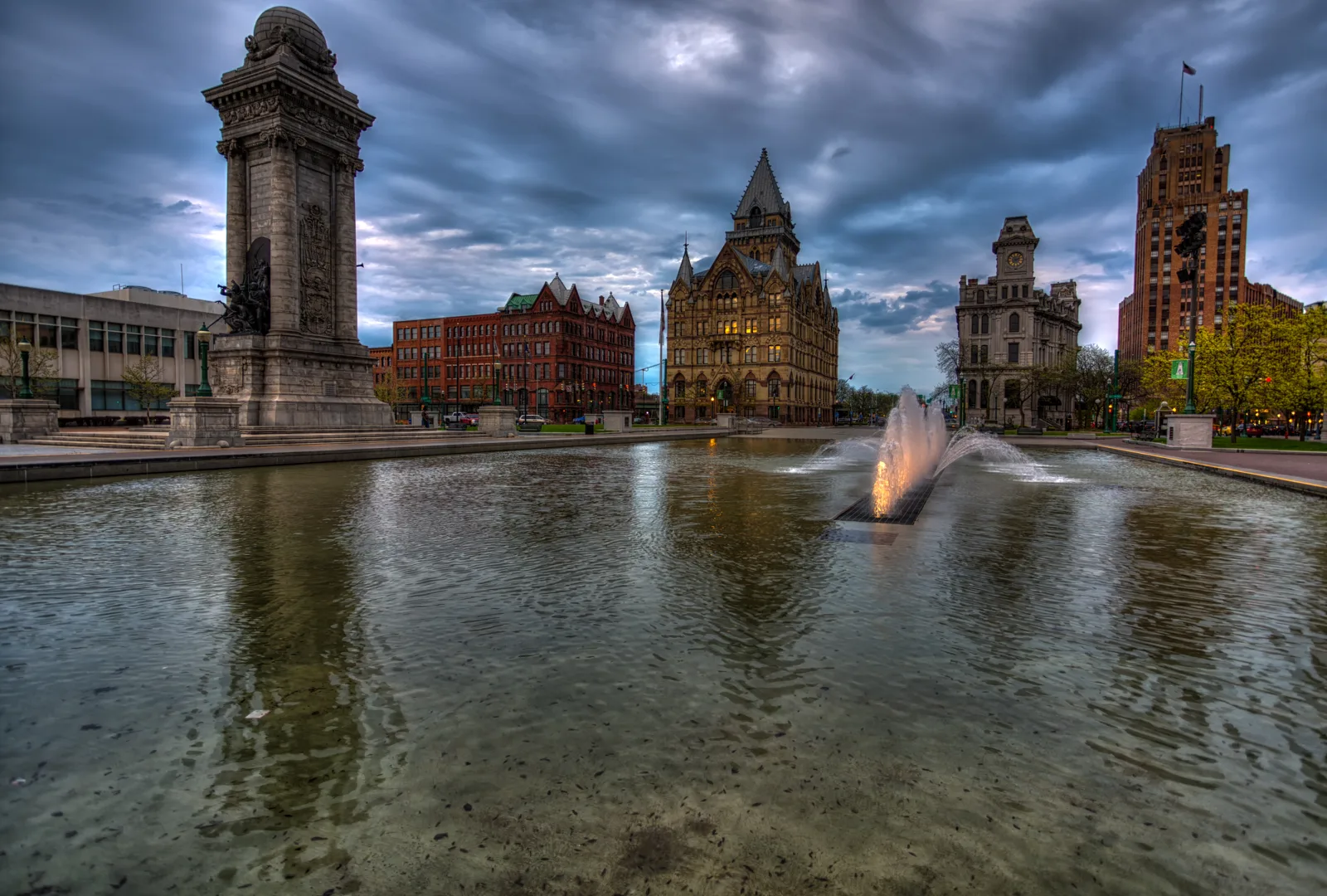 Historic buildings surrounding Clinton Square in downtown Syracuse at dusk